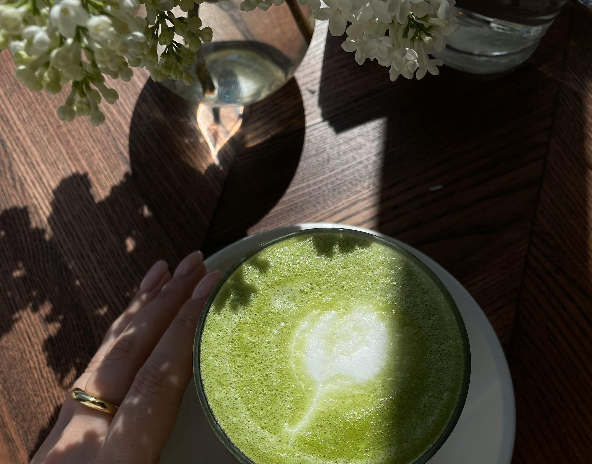 Blog: The Art of the Matcha Ritual: A Mindful Morning Practice, image of matcha green in a cup with morning sun