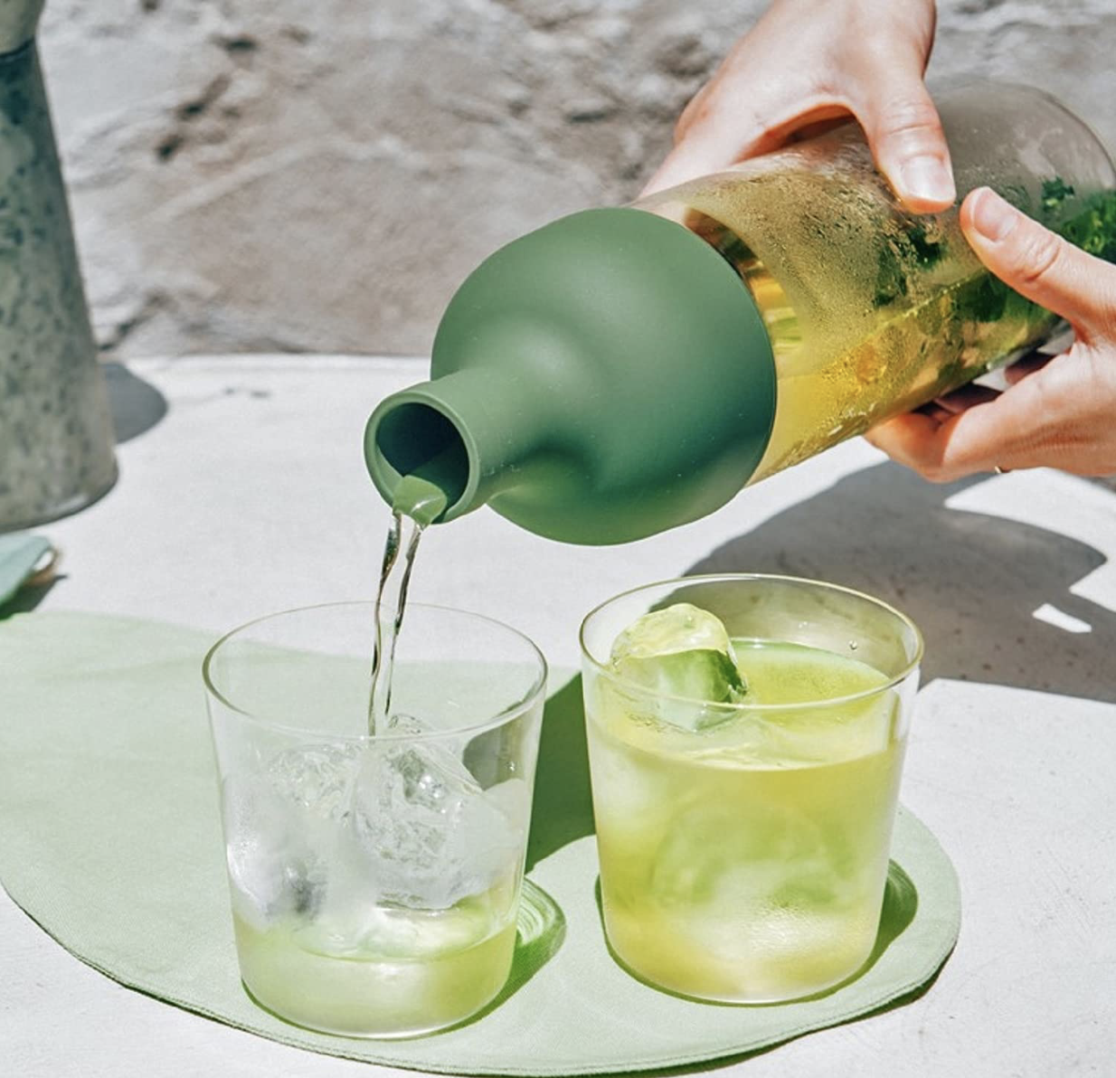HARIO Cold Brew "Wine" Bottle at Wild Orchard Tea, olive green top, image of serving cold tea