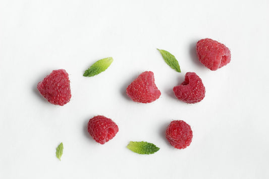 Rose Green Raspberry Spritzer Recipe by Wild Orchard Tea, image of raspberries and tea leaves