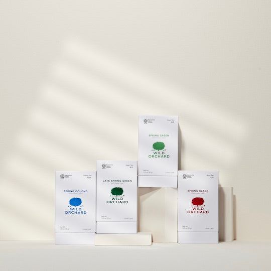 Spring Green Tea - Loose Leaf by Wild Orchard Tea, image of variety of teas in boxes