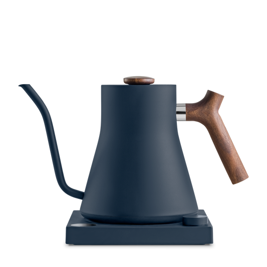 FELLOW Precision Kettle ffered at Wild Orchard Tea, image of tea kettle in blue and walnut or maple wood