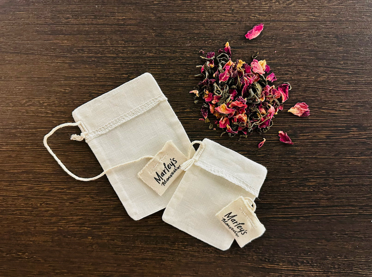 Marley's Monsters Organic Reusable Tea Bags offered at Wild Orchard Tea, image of two bags and loose leaf tea