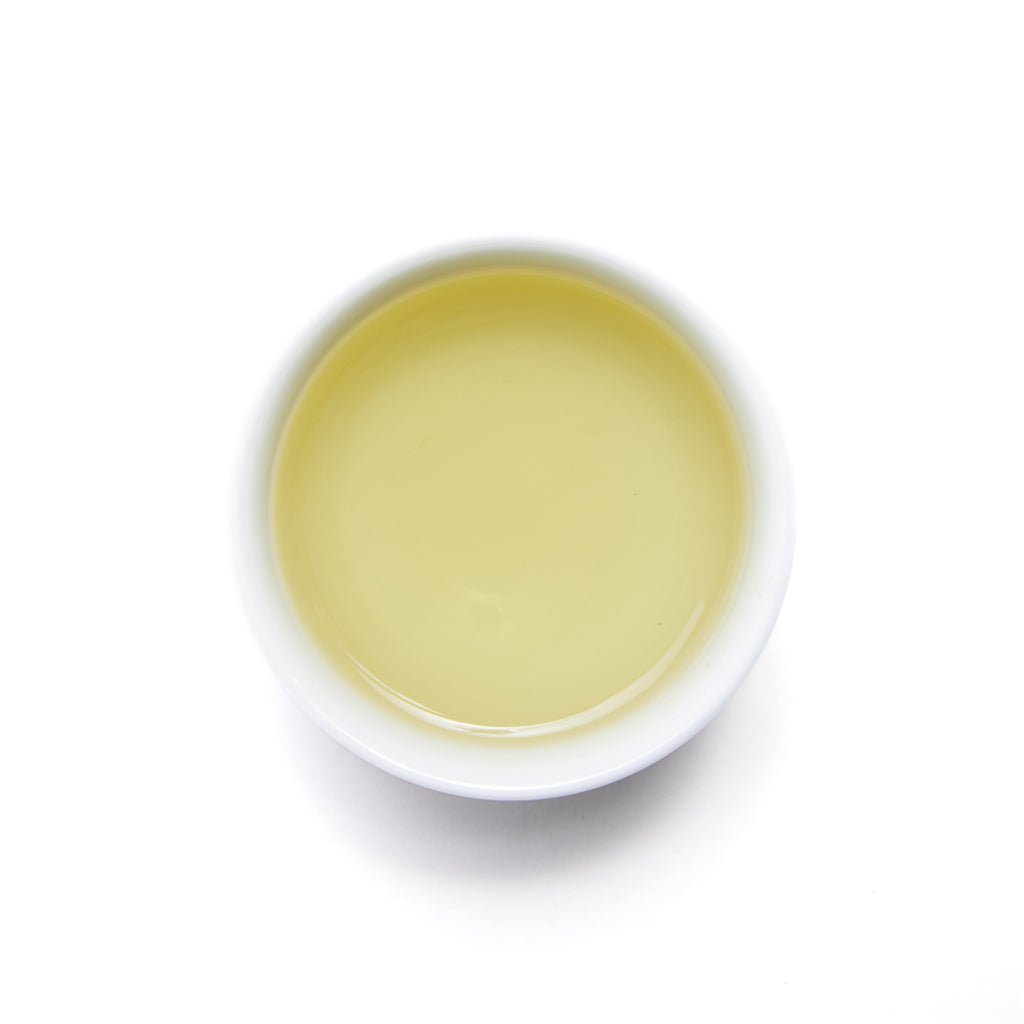 Late Spring Green Tea - Loose Leaf by Wild Orchard Tea, image of brewed tea in a cup