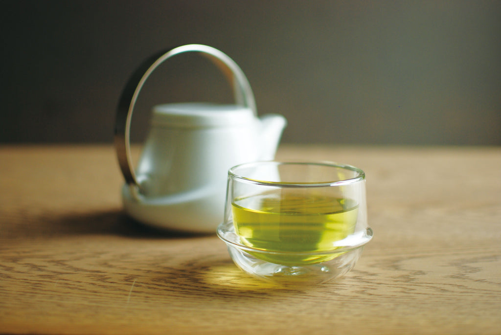 KINTO Double Wall Teacups at Wild Orchard Tea, image of a teacup with brewed green tea
